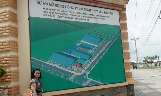 Pham Thi Dieu Hien, president and CEO of Bianfishco, with the plans for her new factory that will focus only on value-added seafood production.