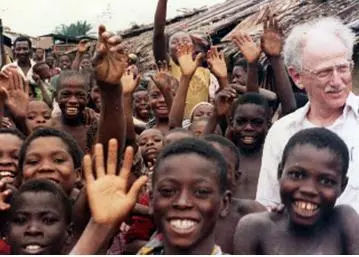 The author with children in a Nigerian fishing village, 1990