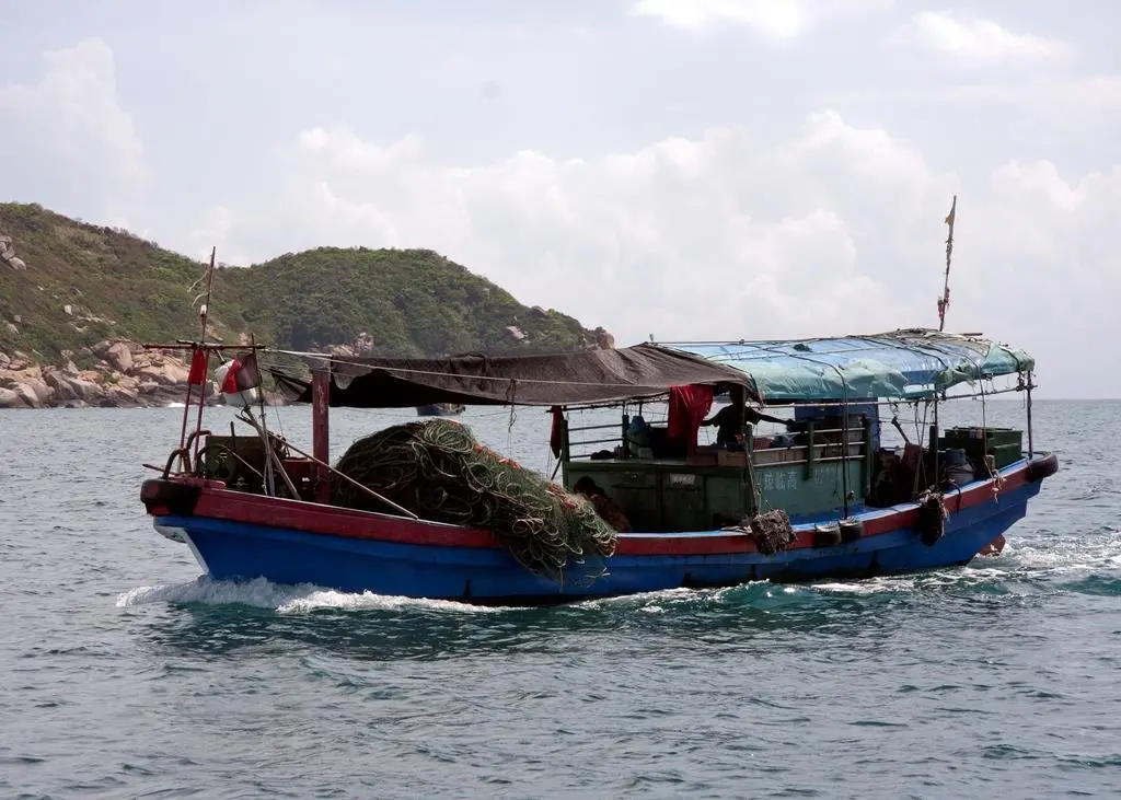 Small fishing boat in Sanya, China. Credit: David Castor