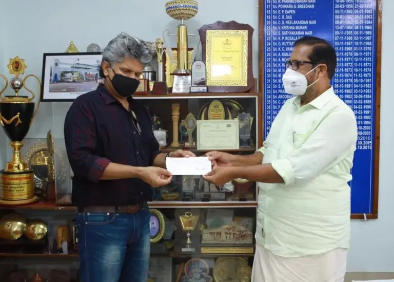 Mathew Joshua, head-executive relations, IBS Software, handing over the cheque to Trivandrum mayor, Mr K Sreekumar Photo: IBS Software