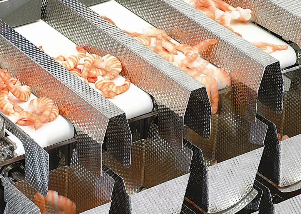 The Ishida Fresh Food Weigher presents another solution to the handling and weighing of sticky products, featuring a linear multihead design, fed by belts from an infeed table