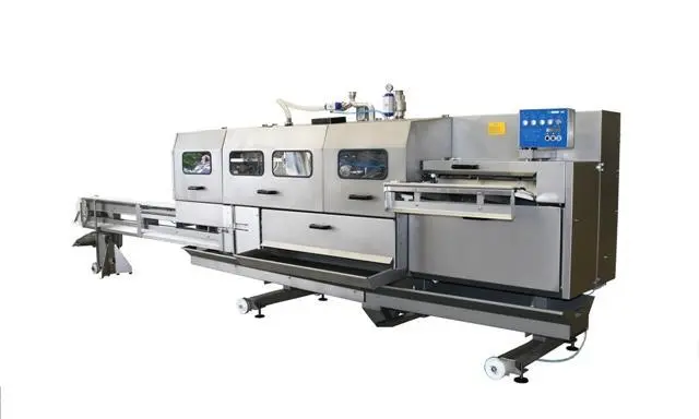 Baader’s more hygienic salmon gutting machine, the new 142.]