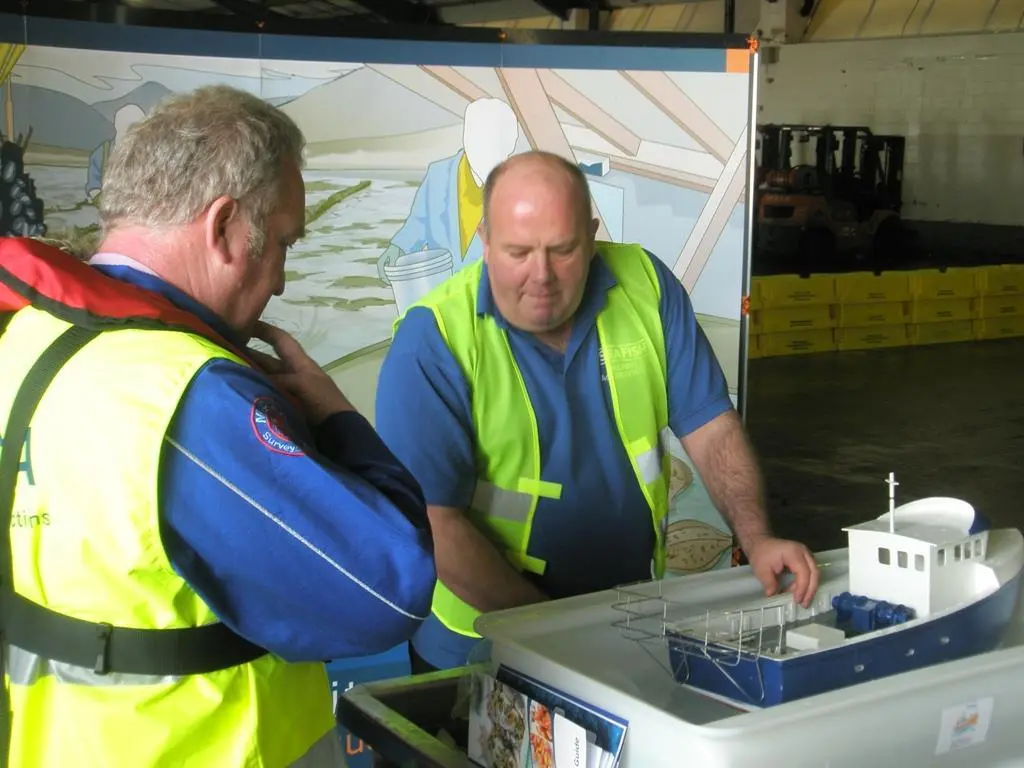 Training Adviser Keir Day demonstrates Seafish’s fishing vessel stability training to Shipping Minister Mike Penning