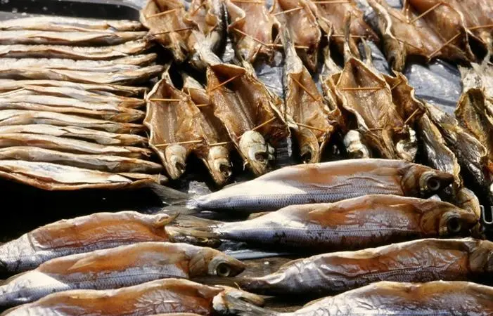Omul fish, endemic to Lake Baikal, Russia, smoked and on sale at Listyanka market. Credit: Jan van der Crabben
