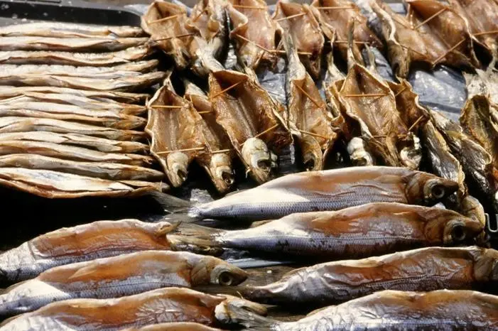 Omul fish, endemic to Lake Baikal, Russia, smoked and on sale at Listyanka market. Credit: Jan van der Crabben