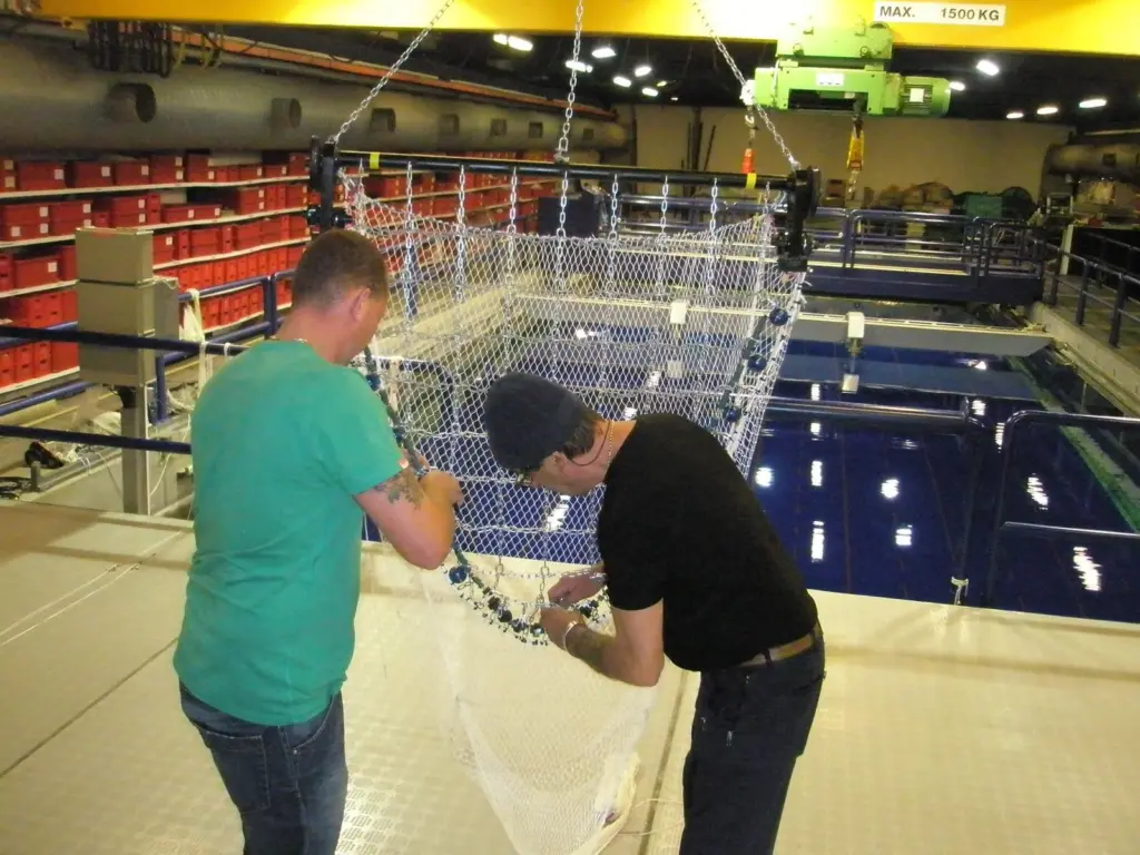 Alterations are made to a beam trawl before shooting it in the flume tank again