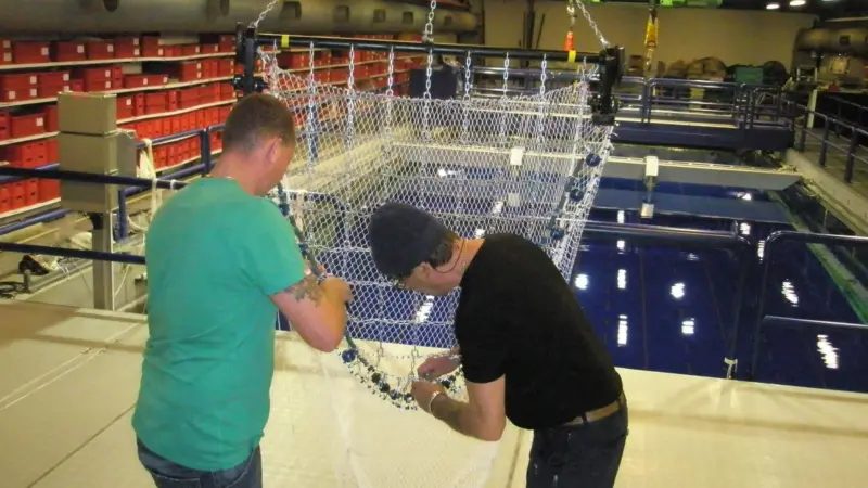 Alterations are made to a beam trawl before shooting it in the flume tank again