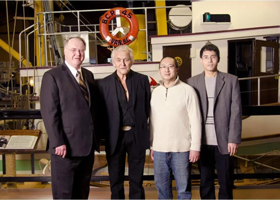 Fisheries and Oceans Minister Keith Ashfield with representatives for the projects receiving federal funding – Chief Bill Cranmer of the 'Namgis First Nation; Brian Yip of Fanny Bay Oysters and Simon Yuan of Maplestar Seafood Ltd