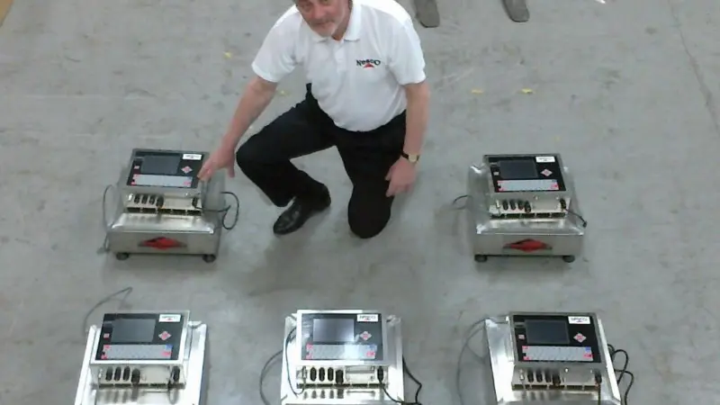 Nesco’s Gordon Norman with the batch of machines prior to dispatch