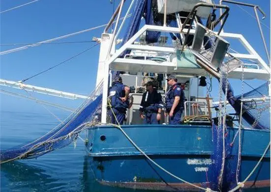 AFMA fisheries officers inspecting a vessel operating in the Northern Prawn Fishery in the Gulf of Carpentaria