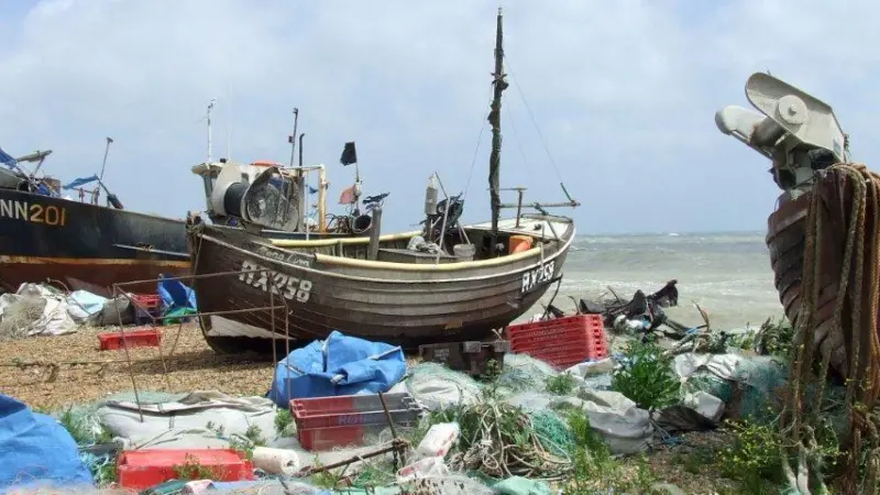 Fishing boats on Hastings beach attract many tourists