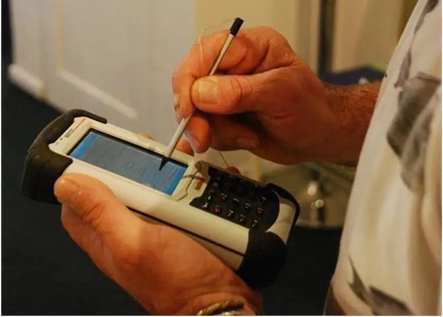 CMO Glenn Caravias from the Territory Force familiarising himself with a handheld data collection unit