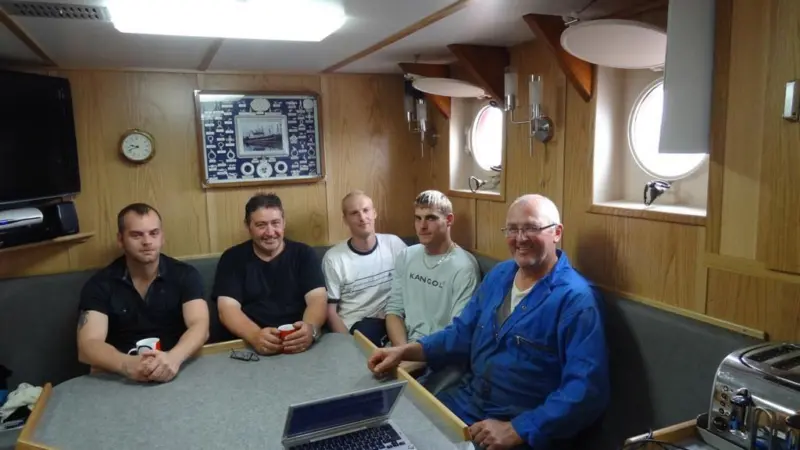 The Amity's crew on completion of their vessel's risk assessment, still smiling. From left to right: Christopher Brown, Jimmy Buchan, James Gemmill, Jamie McLaverty, and Geoff Philips
