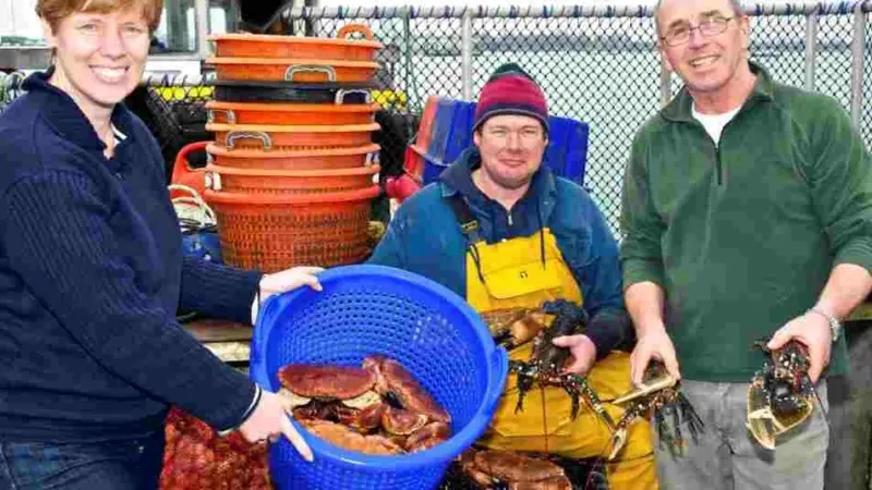 L-R: Henriette Reinders of South East Seafood with local fishermen Tony Bennett and Roger Ramsden and their catch of the day