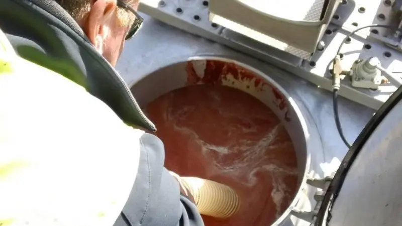 The tanker is filled to the brim with Flow Ice before starting the 320 km journey to the processing plant. The colour is from the fish blood