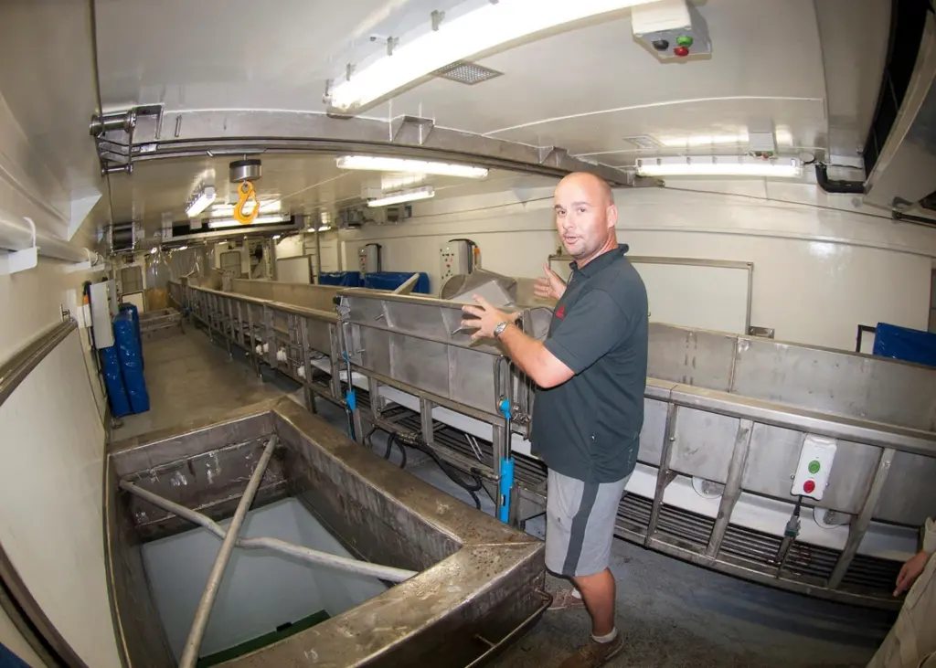 Captain Laurent shows one of the storage holds that the frozen tuna are lowered into. Credit: Haig-Brown photos courtesy of Cummins