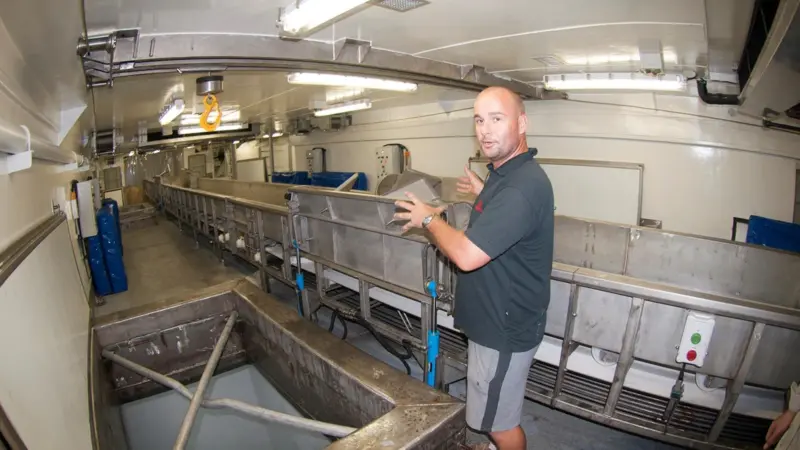 Captain Laurent shows one of the storage holds that the frozen tuna are lowered into. Credit: Haig-Brown photos courtesy of Cummins