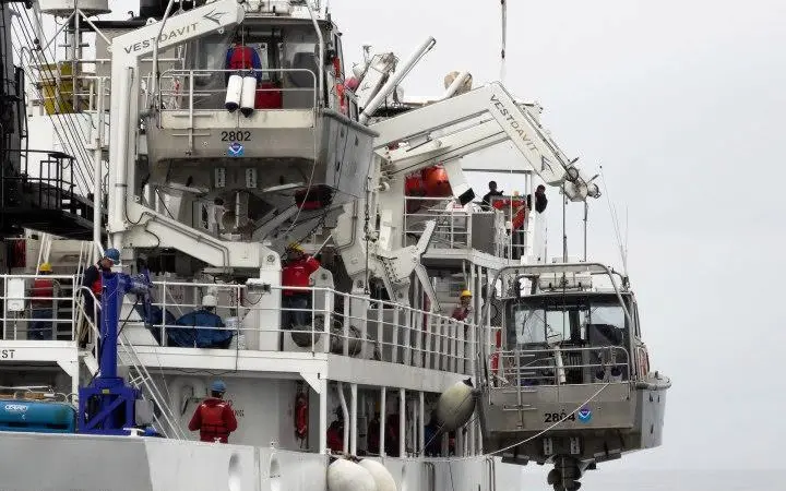 NOAA Ship Rainier and its six small survey boats return to Alaska for a summer of hydrographic surveys. Credit: NOAA