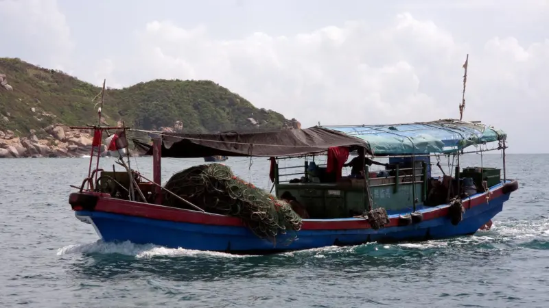 A small fishing boat in Sanya, China. Credit: David Castor