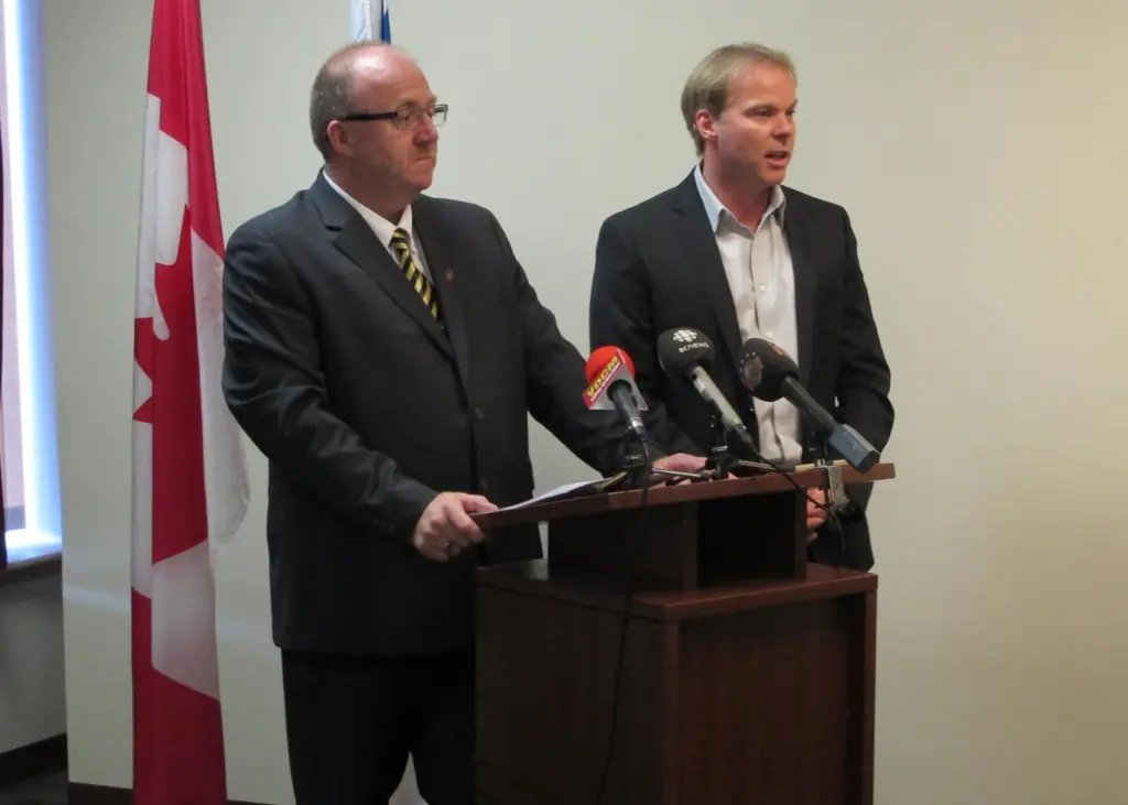 Vaughn Granter, Minister of Fisheries and Aquaculture, is joined by Robin Quinlan, Vice President of Quinlan Brothers Limited for the announcement of $100,000 to support enhancements at the Quinlan Brothers plant