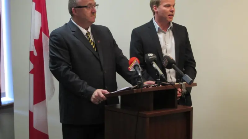 Vaughn Granter, Minister of Fisheries and Aquaculture, is joined by Robin Quinlan, Vice President of Quinlan Brothers Limited for the announcement of $100,000 to support enhancements at the Quinlan Brothers plant