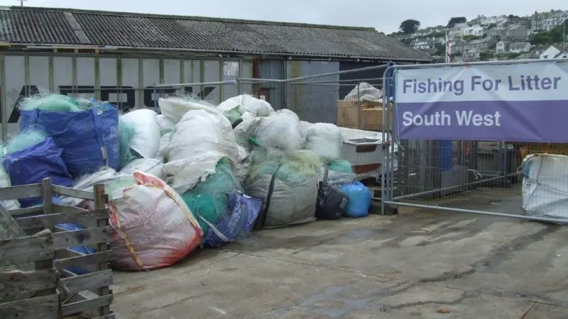 Fishing for Litter at Newlyn Harbour, UK