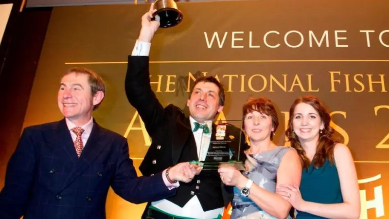 Awards host BBC Radio 2’s Nigel Barden crowning Frankie’s Fish & Chips the UK’s best fish and chip shop. L-R: Nigel Barden, Frankie’s manager John Gold, owner Valerie Johnson, and colleague Carlyn Johnston