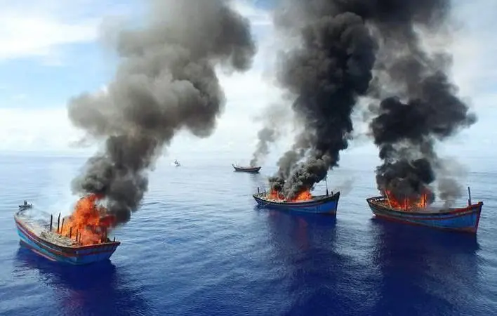 Four Vietnamese boats were burnt in June after Palau authorities caught them fishing illegally. © Jeff Barabe for The Pew Charitable Trusts