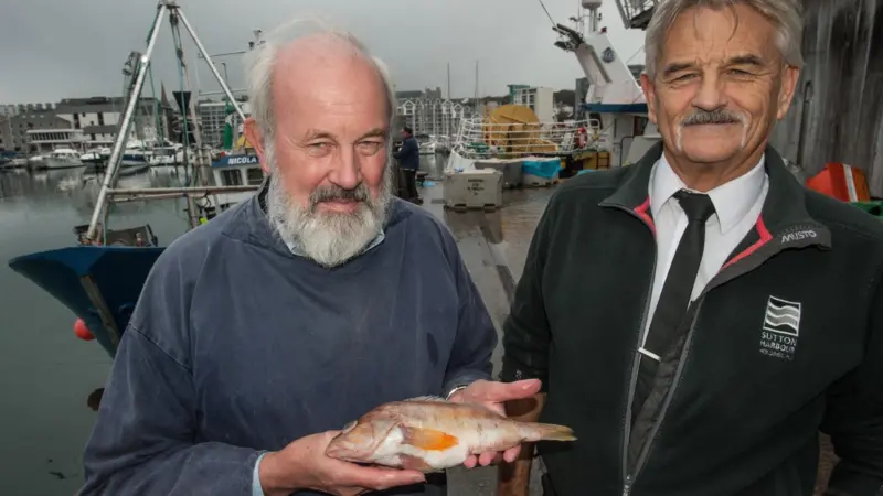 Doug Herdson and Pete Bromley with rare fish at Plymouth Fisheries