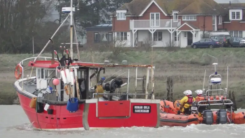 Ronan Orla being accompanied back to Rye Harbour by the RNLI inshore lifeboat