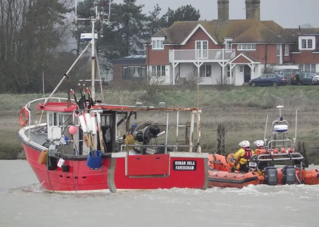 Ronan Orla being accompanied back to Rye Harbour by the RNLI inshore lifeboat