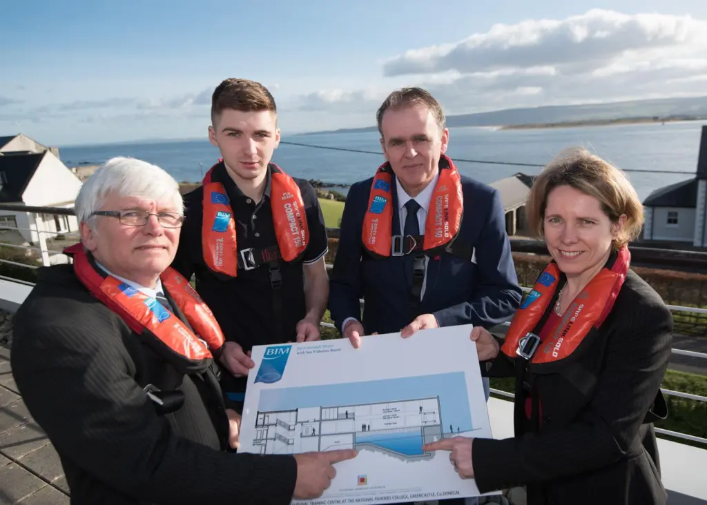 (l-r) BIM principal Captain James Hegarty, student Paul Cunningham, Joe McHugh TD and BIM CEO Tara McCarthy displaying plans for the new sea survival training centre