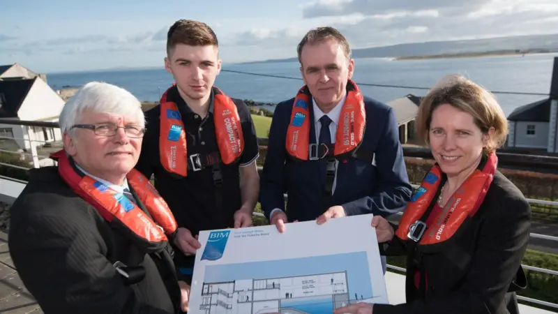 (l-r) BIM principal Captain James Hegarty, student Paul Cunningham, Joe McHugh TD and BIM CEO Tara McCarthy displaying plans for the new sea survival training centre