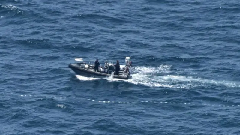 The two tonne net was retrieved by hand which took over 24 hours to complete Photo: AFMA