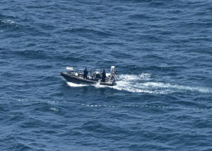The two tonne net was retrieved by hand which took over 24 hours to complete Photo: AFMA