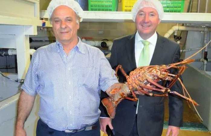 Bluwave's George Stavrinos, left, with Fisheries Minister, Joe Francis