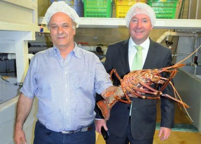 Bluwave's George Stavrinos, left, with Fisheries Minister, Joe Francis