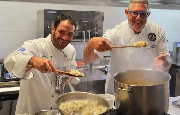 Chefs Peter Manifis and Don Hancey prepare a magnificent squid risotto for the teachers' lunch