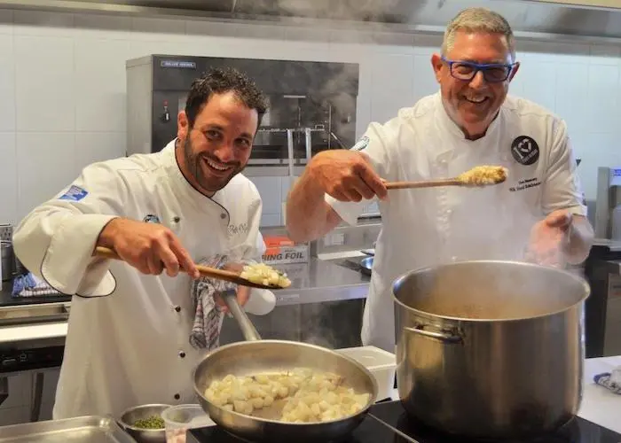 Chefs Peter Manifis and Don Hancey prepare a magnificent squid risotto for the teachers' lunch