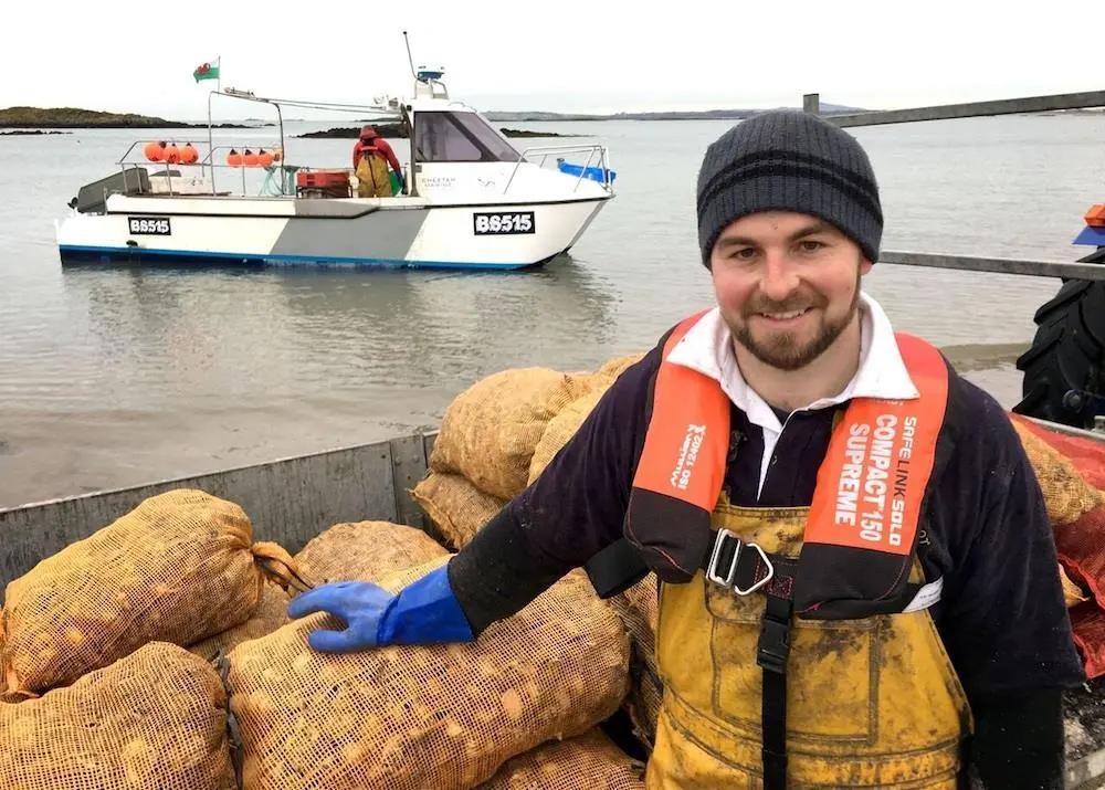 Fisherman wearing a Personal Flotation Devices