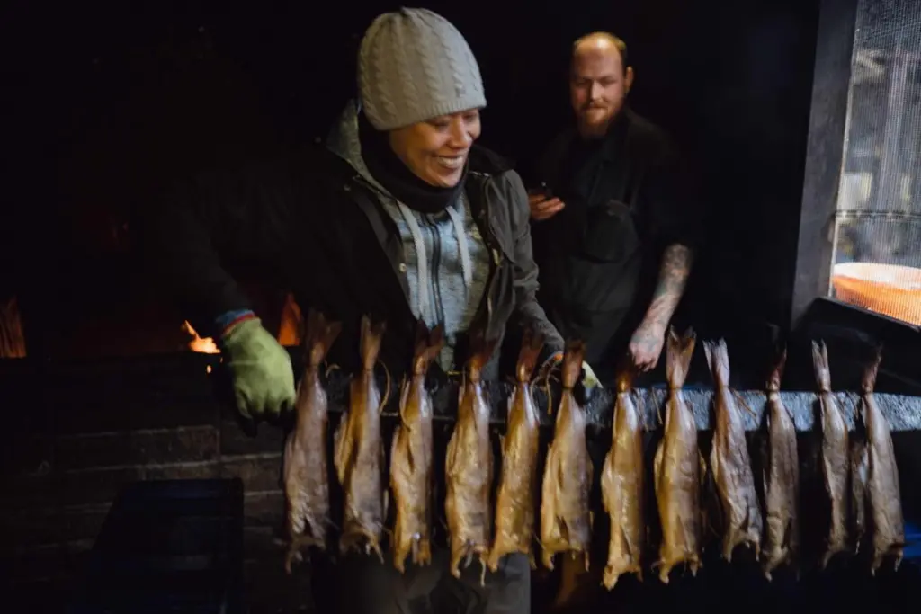 Monica Galetti demonstrates her smoking skills with Gary Morrison-Lundie, smoker, at Alex Spink & Sons, Arbroath
