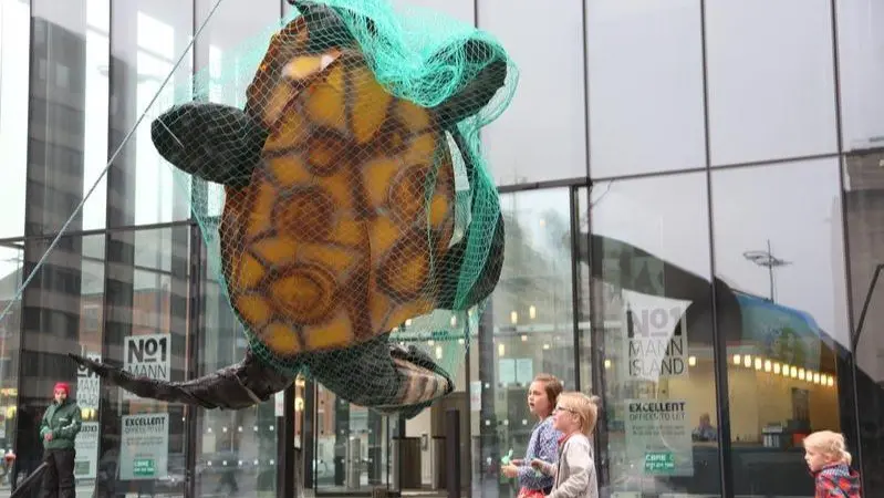 Greenpeace has previously used a giant turtle in a net outside John West's HQ to bring attention to unsustainable fishing methods