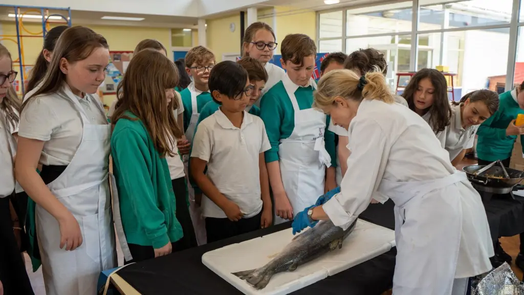 Children in Letchworth being shown how to prepare fish