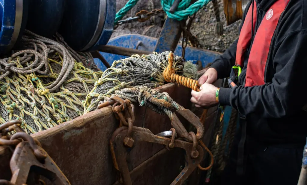 Fisherman mending a net
