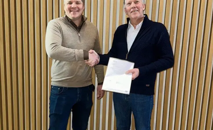Representatives from Marel and Laxey celebrate a new deal to supply processing equipment for a land-based salmon faciliy