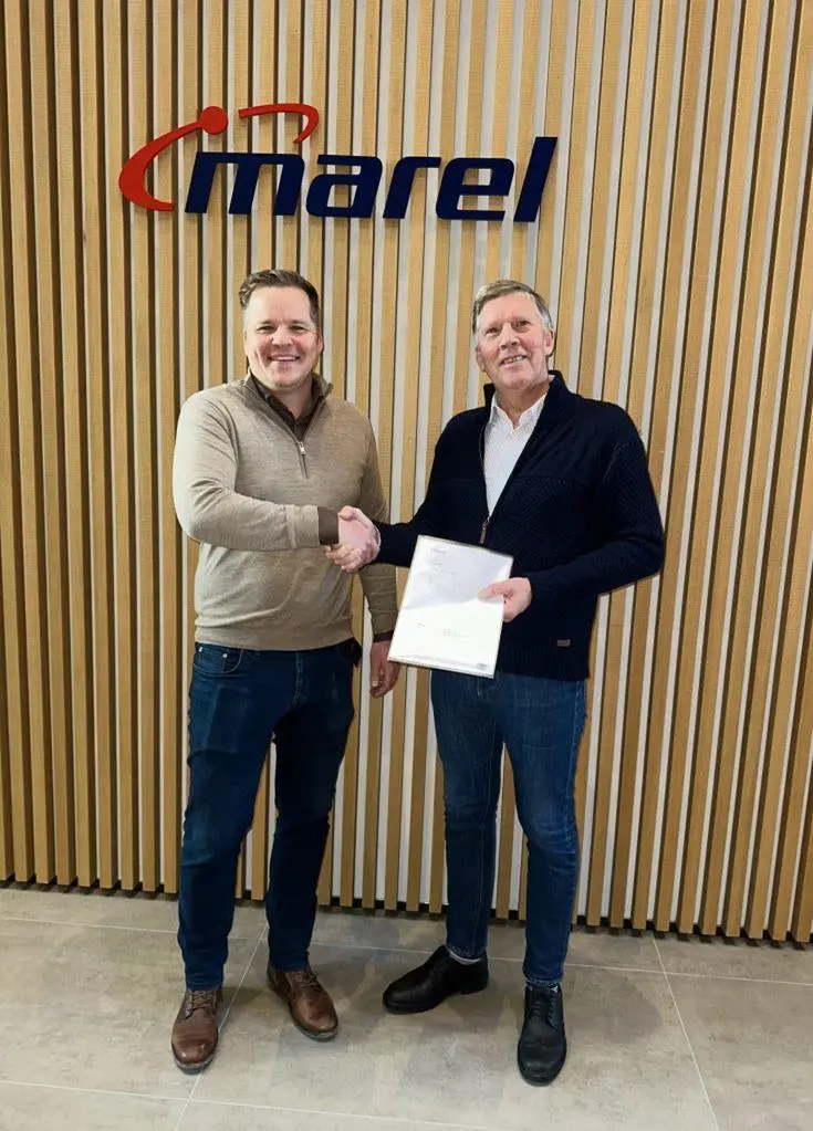 Representatives from Marel and Laxey celebrate a new deal to supply processing equipment for a land-based salmon faciliy