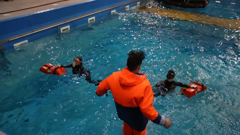 Fishermen being trained on survival skills in a purpose-built pool