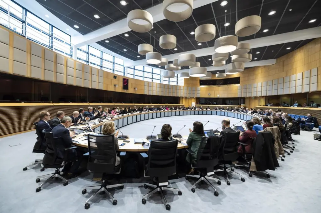 Delegates at a European Commission meeting sitting in a large oval