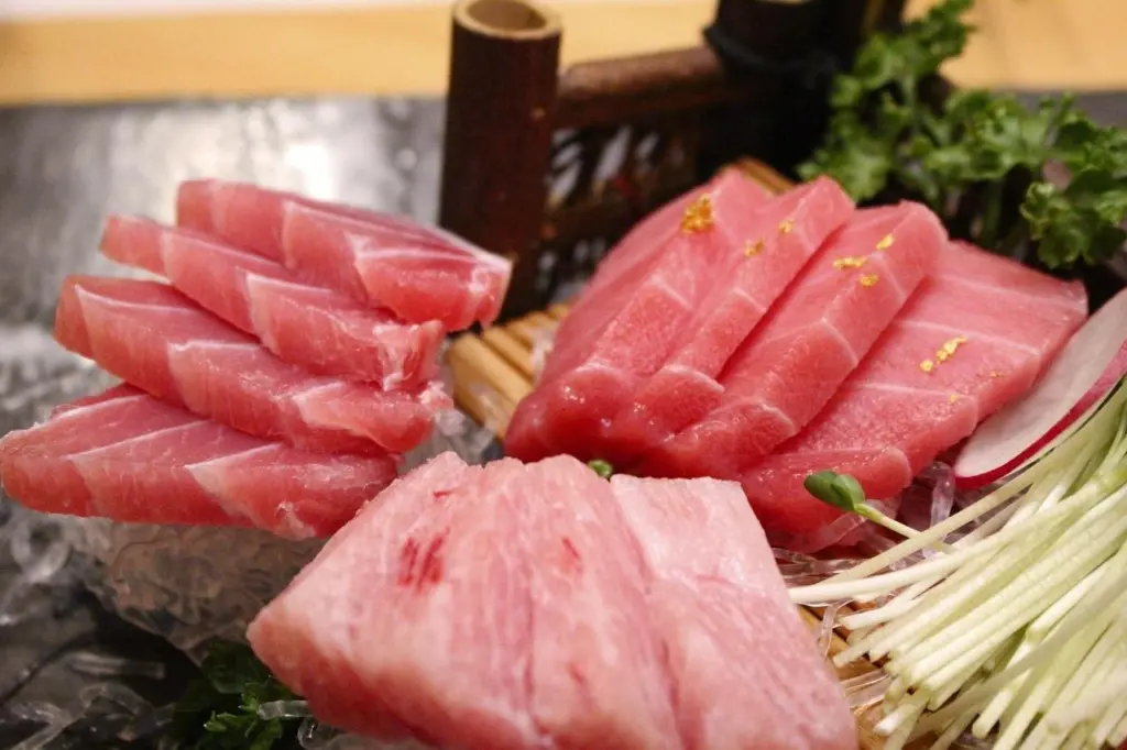A picture of tuna on the plate with rice