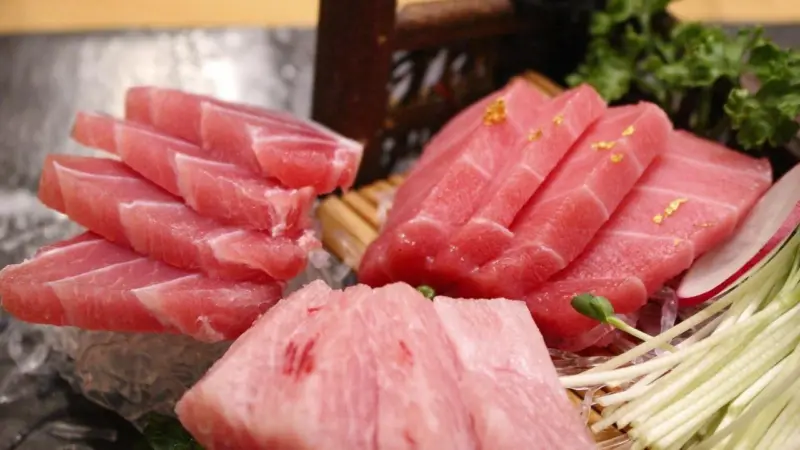 A picture of tuna on the plate with rice